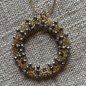 Lovely bead and gold and silver circle on silk cord necklace